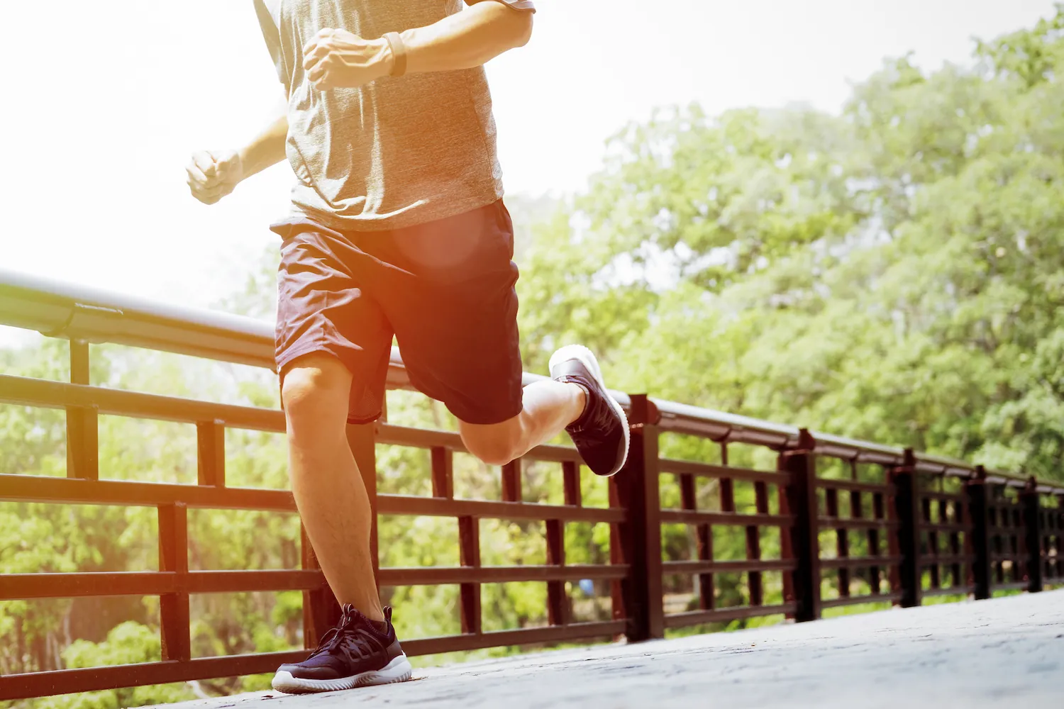 Man jogging on a bridge outdoors