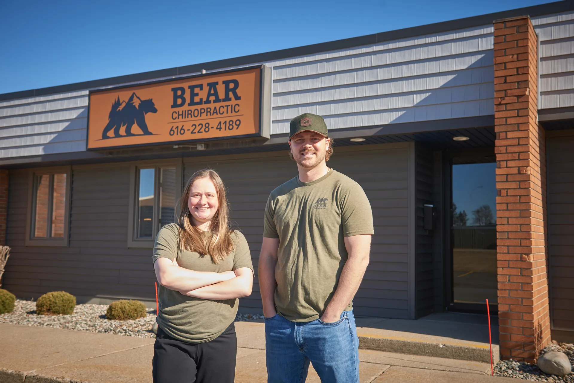 Two Bear Chiropractic team members standing outside the office